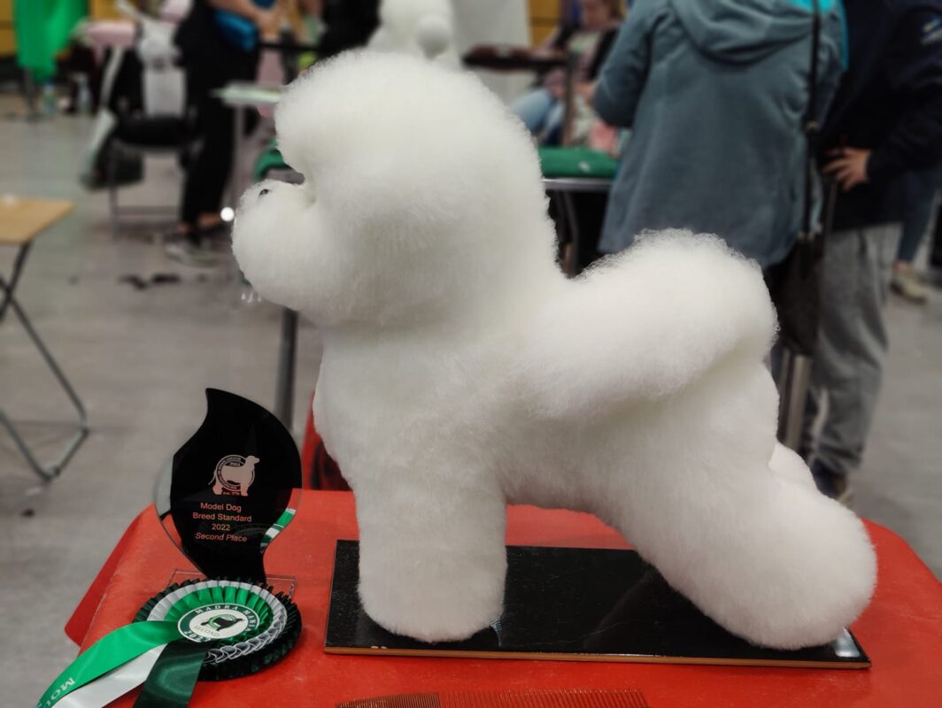 Bichon Full Body Model Dog Hair White Wig is ideal for practising scissoring techniques in grooming schools to teach students safely and efficiently.